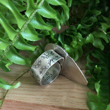 Load image into Gallery viewer, Bottom band view of adjustable band and stamped details on the white oak inspired ring with jasper stone in sterling silver
