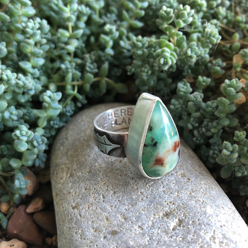Side view of Chrysoprase Holly Ring, details of stamping and handcut holly leaf size 6.75